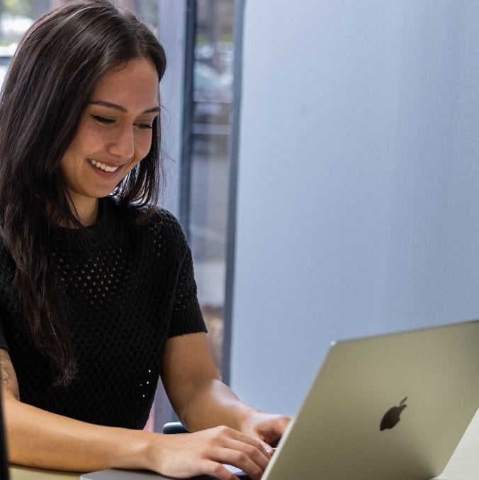 Private office space for professionals Woman in private office space in San Jose with short-term lease