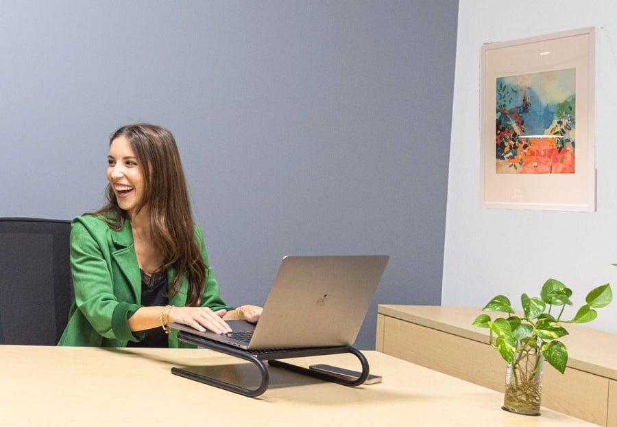 Female Freelancer at desk with laptop using virtual office in Pleasant Hill CA Young lady working in virtual office in Walnut Creek