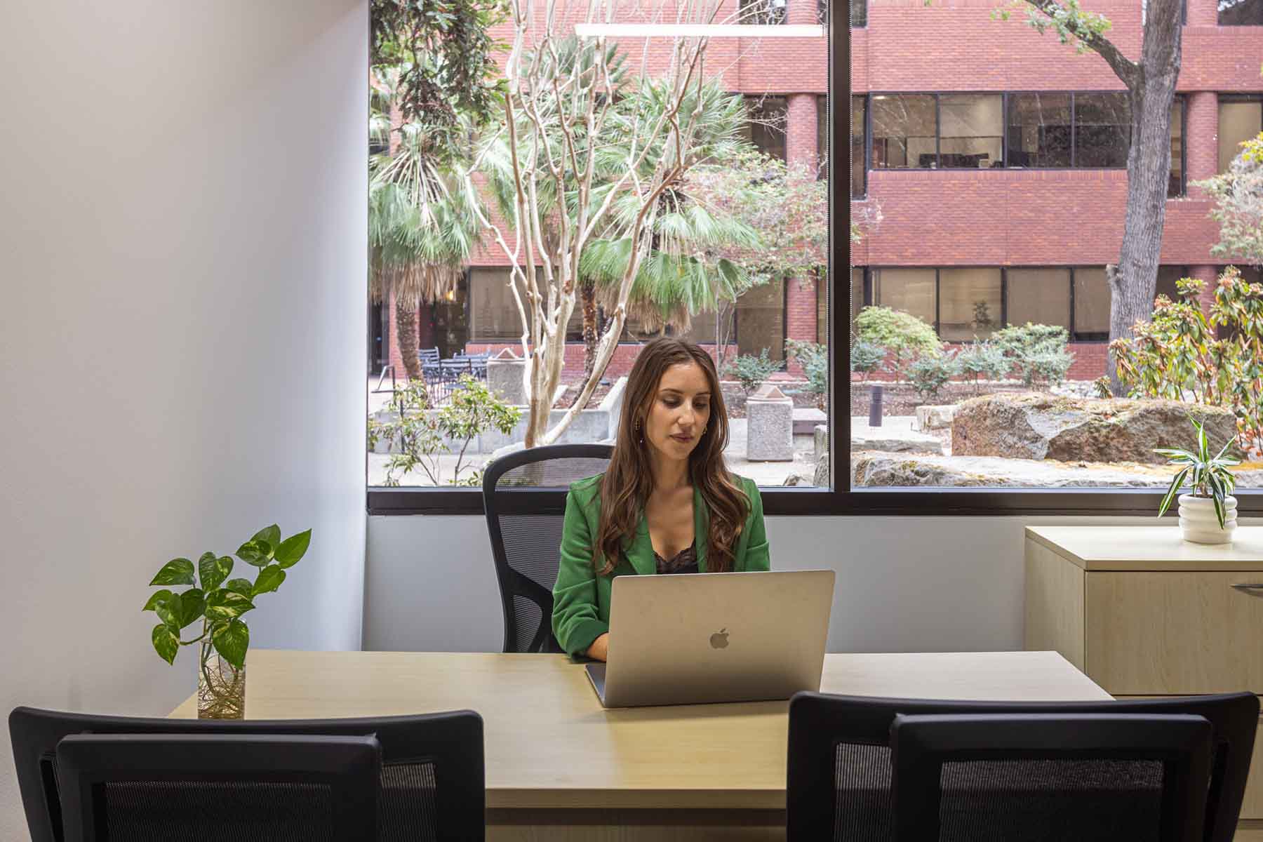 Woman using laptop in private office space in Pleasant Hill