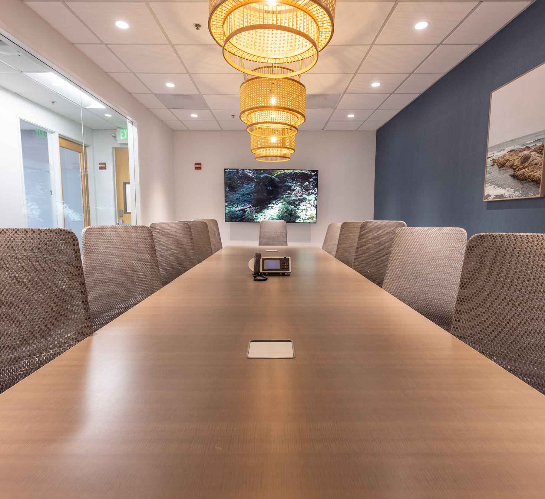 Table with chairs in meeting room at Pacific Workplaces Pleasant Hill