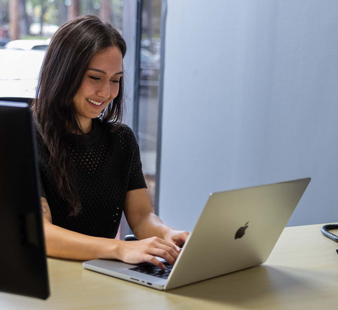 Woman working at desk in coworking space in Reno