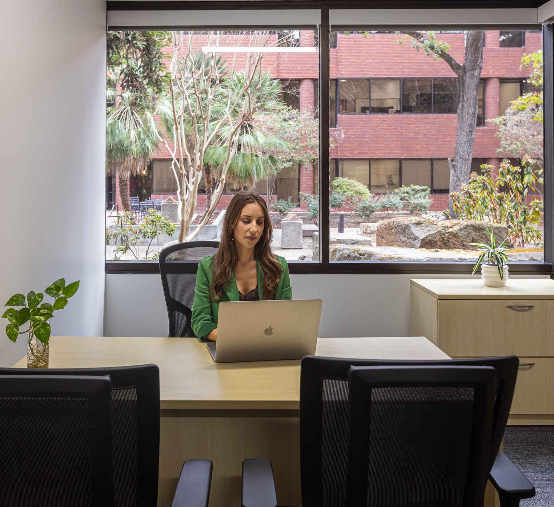 Woman at desk with laptop in coworking space in Pleasant Hill