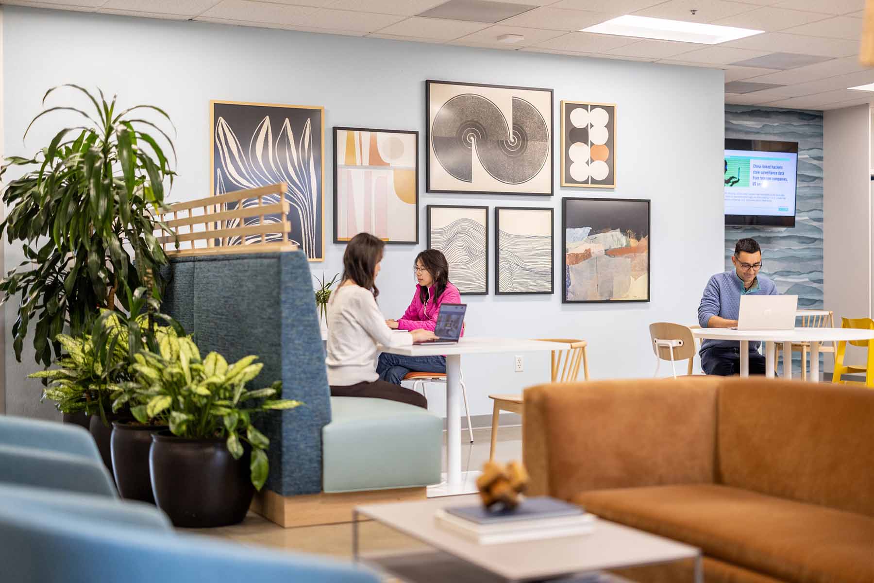 Three people using the open coworking in Cupertino at Pacific Workplaces