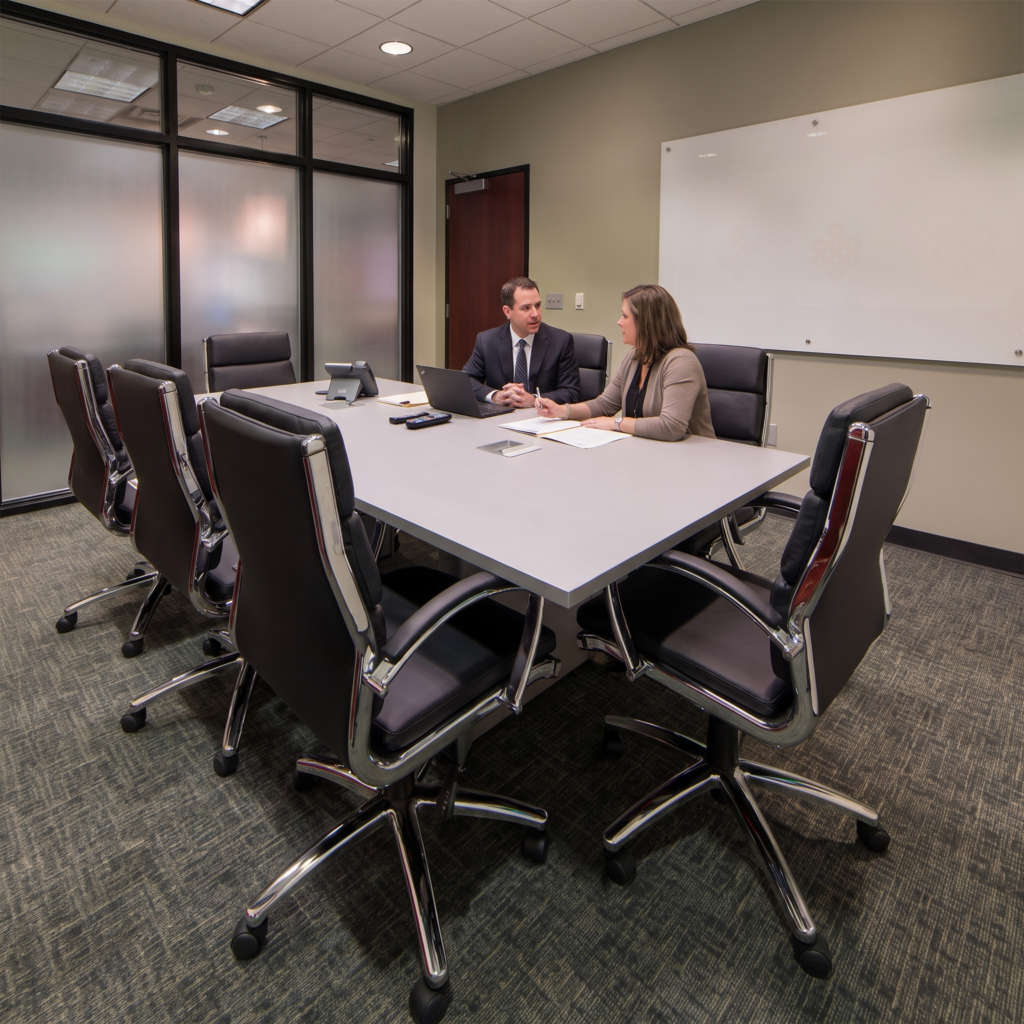 best_coworking_spaces_for_lawyers male and female lawyer working together in a meeting room at pacific workplaces