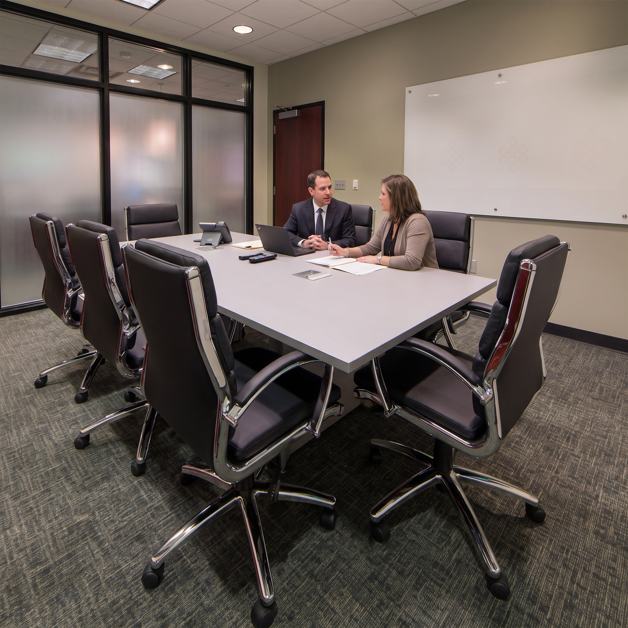 best_coworking_spaces_for_lawyers male and female lawyer working together in a meeting room at pacific workplaces